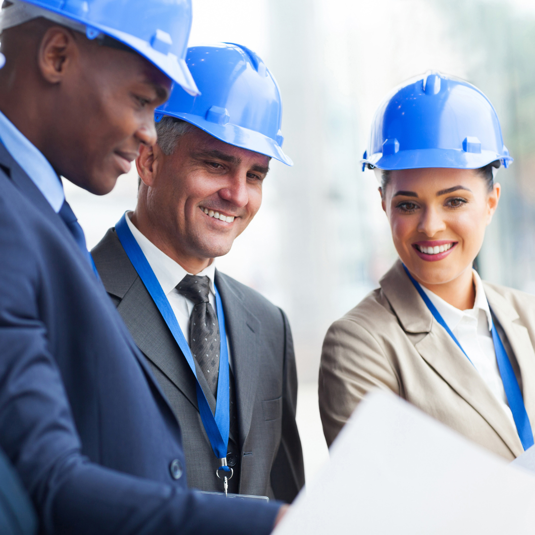 three people on a construction hat