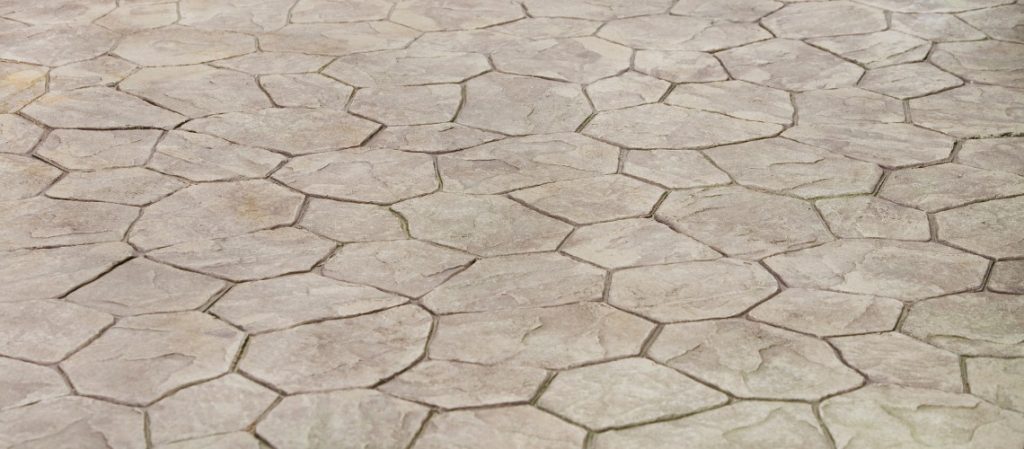 A grey flagstone-patterned stamped concrete