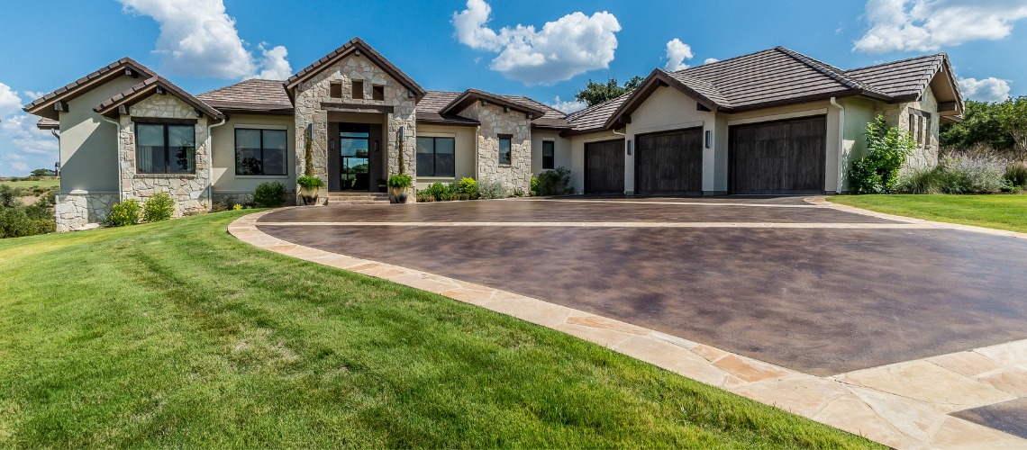 dark brown textured stamped concrete driveway